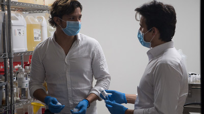 Lorenzo De Plano and Eric Anwar overseeing production line