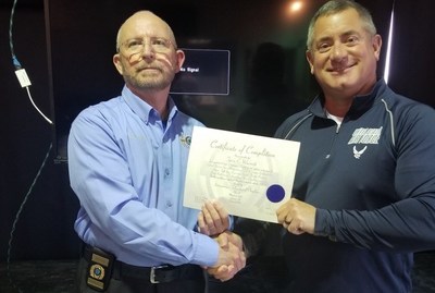 Pastor Ross Presenting Certification to Captain Warmoth
