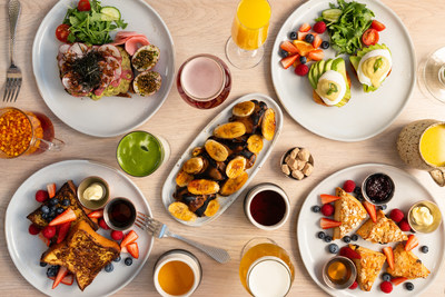 Example breakfast spread including torch-blased banana toast, scone platter, eggs benedict, challah french toast and avocado toast.