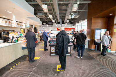 Markers were installed on the floor to enforce social distancing at the checkout line. (CNW Group/Alimentation Couche-Tard Inc.)