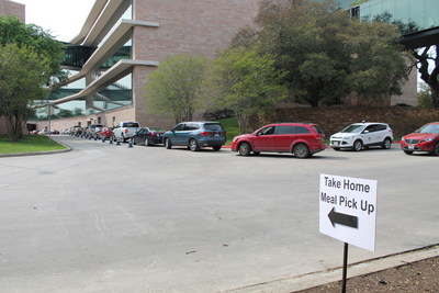 USAA employees line up for curbside pick-up of meals and essential grocery food items across its corporate campuses. USAA and Sodexo announced the new and unique benefit to the nearly 35,000 USAA employees nationwide.