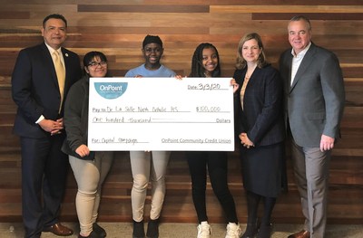 OnPoint President and CEO, Rob Stuart and Chief Talent Officer, Jackie Dunckley present a $100,000 donation to De La Salle North Catholic High School’s President, Oscar Leong and three students completing their work-study program at OnPoint.