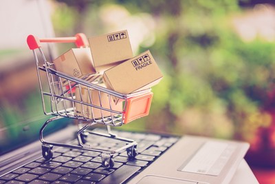 Online shopping and delivery service concept. Paper cartons in a shopping cart on a laptop keyboard, this image implies online shopping that customer order things from retailer sites via the internet. (PRNewsfoto/Research and Markets)