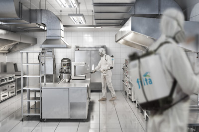 A Filta technician sanitising a commercial kitchen