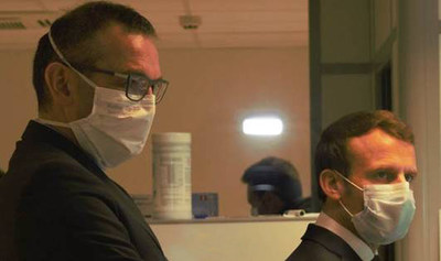 French President Emmanuel Macron pictured with Kolmi-Hopen General Manager, Gérald Heuliez. (CNW Group/AMD Medicom Inc.)