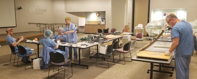 Children's Minnesota employees join together to make face shields for frontline staff.