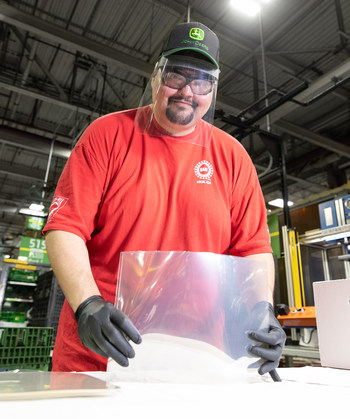 Jerry Miller, an assembler at John Deere Seeding Moline, assembles protective face shields for health-care workers as part of a partnership between the UAW and John Deere to provide the face shields to health-care workers in 17 of Deere's US manufacturing communities.