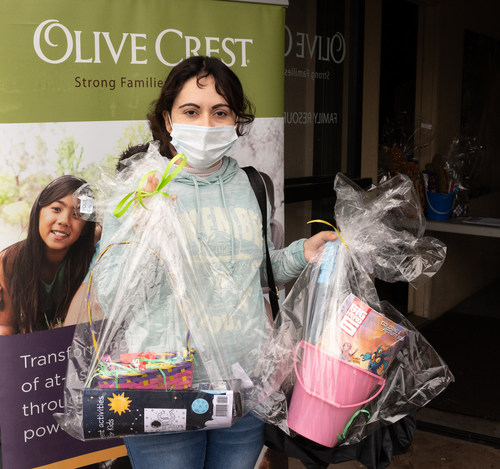 Parent Susana Rodriguez picks up Olive Crest Easter basket in Bellflower, California. Photo courtesy of Olive Crest.