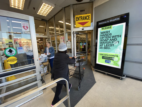Starlite Media's large-format screens at store entrances communicate both brand and public service messages.