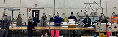 ZF, one of the world's largest automotive suppliers, prepares its first shipment of face masks to Detroit Sewn as part of our collaboration to defeat the Covid-19 corona virus. ZF is a world leader in safety systems and other technologies and, as a manufacturer of airbags, an expert in cut & sew operations. Pictured (left to right): Dan Miller, Fleming Pachucki, Lilia Rivera, Charlynn Walker, Julie Schoenherr, Brett Correll, Ryan Murphy (holding box of 1000 masks), Cathy Reis, Jake Wycinski, Jill Ladner, and Nick Thorp