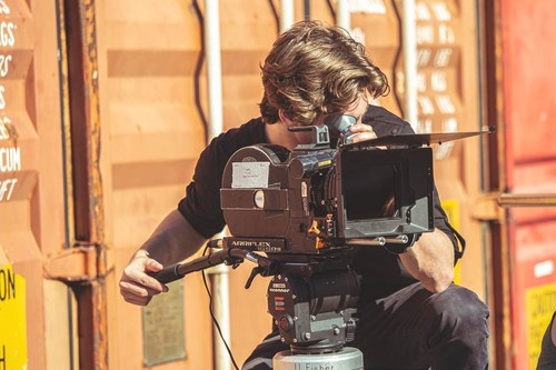 Film Production student shooting with an ARRI camera on The Los Angeles Film School campus.
