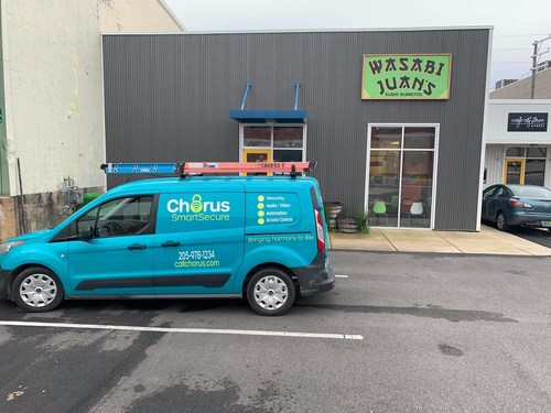 Chorus van parked at a local restaurant during security system installation