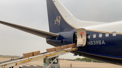 A Boeing-owned aircraft loads 540,000 medical-grade masks in China destined to New Hampshire. (Boeing photo)