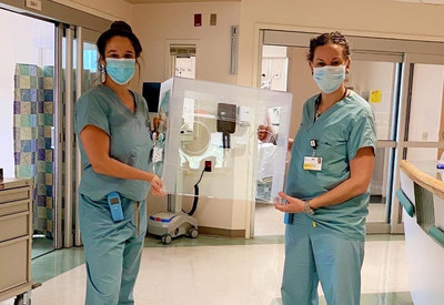 Nurses at the University of Maryland holding an intubation box that was made and donated by The Flex Seal Family. Photo Courtesy of Ashlee Perez