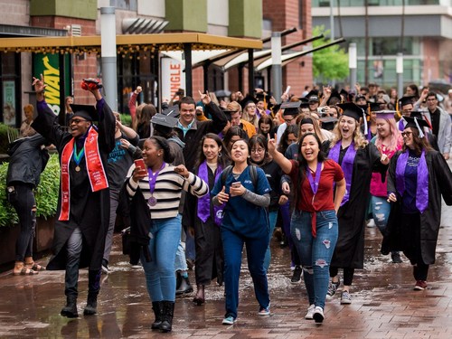 A touching senior moment, celebrating their time at Grand Canyon University, broke out on Lopes Way on March 13th after it was announced that the final four weeks of classes would be online because of the coronavirus. (Photo by Gillian Rea)