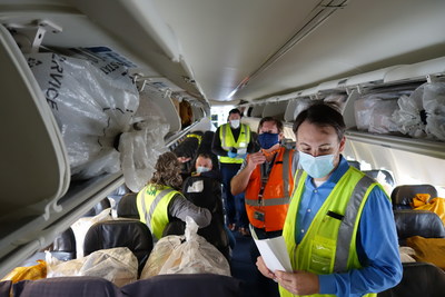 Alaska Air Cargo tests loading freight into the passenger cabin of an Alaska Airlines 737-900 in Seattle. Alaska will be utilizing passenger jets as freighter only aircraft to maximize critical cargo shipments of essential goods.