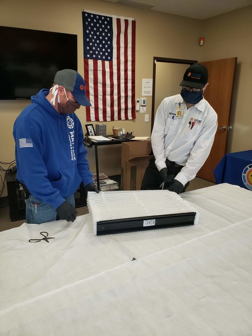 Members of the Comfort Matters Heating & Cooling team convert HVAC filter material to be used in safety masks for the Twin Cities community. The filter inserts are one of several outreach efforts launched by Comfort Matters in response to the effects of COVID-19.