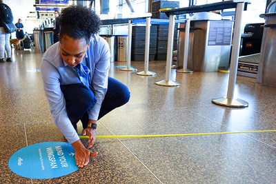 To encourage social distancing, Alaska Airlines is installing floor decals at airports to remind flyers and employees to remain separated by at least six feet.