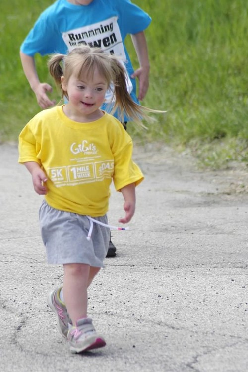 Emma Silverman, age five, participating in GiGi's Playhouse 5k Run and Dash for Down Syndrome at Arlington Park Race Track in 2019.