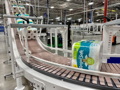 Packages of Angel Soft® bath tissue roll along the production line at a Georgia-Pacific plant in Florida in late March. The company has employees working around the clock to help fill empty store shelves.