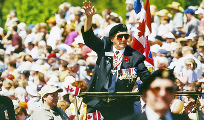 Cliff Chadderton (1919-2013), former CEO of The War Amps and Chairman of the National Council of Veteran Associations, receives a warm welcome at a veterans parade in Apeldoorn, Netherlands in May 2000. (CNW Group/War Amps)