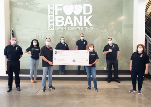 Representatives of Wyatt Law Firm present a $100,000.00 check to the San Antonio Food Bank on May 4, 2020.