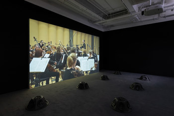 Muted Situations #22: Muted Tchaikovsky’s 5th, 2018, HD video, eight-channel sound installation, and carpet, 45 min, Courtesy of the artist Installation view, 2019. Image: Winnie Yeung @ iMAGE28 Courtesy of M+, Hong Kong