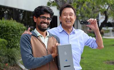 Fluxergy's Co-Founder & President Tej Patel (left) and Investor & Co-Founder of Kingston Technologies, John Tu (right) with the Fluxergy Analyzer and Test Card.