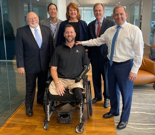 QL+ and PenFed at PenFed Headquarters in Tysons, Va. Left to right front: Jon Monett, QL+ Founder and President; Adam Keys, QL+ beneficiary; James Schenck, PenFed President and CEO. Left to right back: Steve Bosack, PenFed Special Advisor to the President and Chief Communications Officer; Catherine Harkins, QL+ Director of Finance and Administration; and Charlie Kolb, QL+ Executive Director.