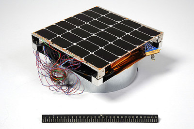 Image of the Photovoltaic Radio-frequency Antenna Module (PRAM) with a 12-inch ruler for scale. The hardware is the first orbital experiment designed to convert sunlight for microwave power transmission for solar power satellites. (Image Courtesy of U.S. Naval Research Laboratory)