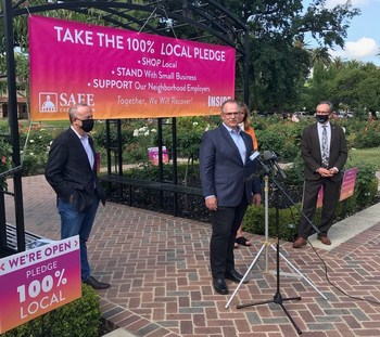 From left, Sacramento Mayor Darrell Steinberg, SAFE Credit Union President and CEO Dave Roughton, and Sacramento Vice-Mayor Jeff Harris discuss the 100% Local Pledge initiative Tuesday, May 19, 2020, in Sacramento, California.