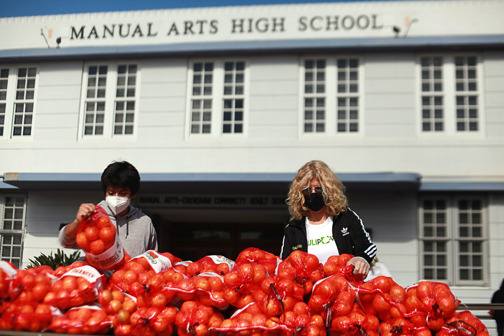 Founder and CEO of CAULIPOWER Gail Becker provides food relief assistance at Manual Arts High School in Los Angeles, CA in collaboration with the American Heart Association