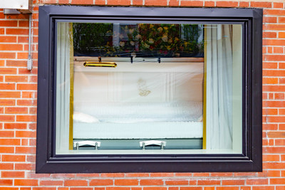 Through a large glass window, grieving family and friends will have the opportunity to view their deceased loved one and pay their final respects.