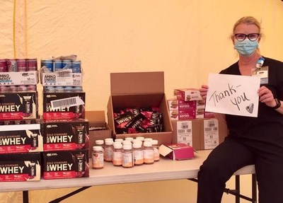 Susan Tiso of the School of Nursing at UC Irvine offers thanks to Optimum Nutrition for a shipment of high-quality performance nutrition products donated by the brand to support clinical workers and first responders during the COVID-19 pandemic.