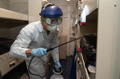 200412-N-LH674-1007 APRA, Guam (April 12, 2020) U.S. Navy Aviation Electrician’s Mate 3rd Class Kyle Hernandez, from Denton, Texas, assigned to the Tomcatters of Strike Fighter Squadron (VFA) 31, disinfects a berthing aboard the aircraft carrier USS Theodore Roosevelt (CVN 71). (U.S. Navy photo by Mass Communication Specialist Seaman Kaylianna Genier.)