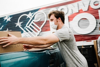 Volunteers load hundreds of cars with much needed food and supplies from Convoy of Hope at a distribution site in Darlington, South Carolina.