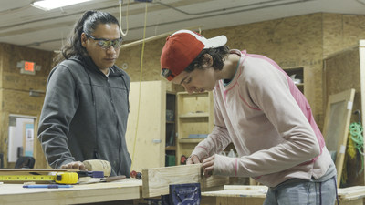 Core Neighbourhood Youth Co-op (CNYC) instructor Ace Lafond (left) provides woodworking tips to student Gage Ritchie-Nadeau. The local organization recently received a multi-year grant from The Co-operators Community Funds to help support its programming for marginalized youth. (CNW Group/The Co-operators)