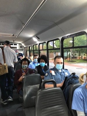 Brigham and Women's Hospital shuttles at Crosstown as they filled with hospital staff. Picture taken by MNA June 15, 16 and 17.