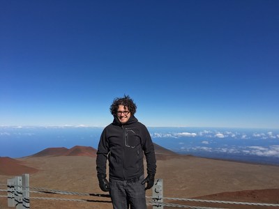 Jonathan Gagné at the summit of Mauna Kea, where astrophysicists have been making observations since 2010 at the NASA's Infrared Telescope Facility (IRTF) to find planets around AU Mic. Credit: Jonathan Gagné. (CNW Group/Espace pour la vie)