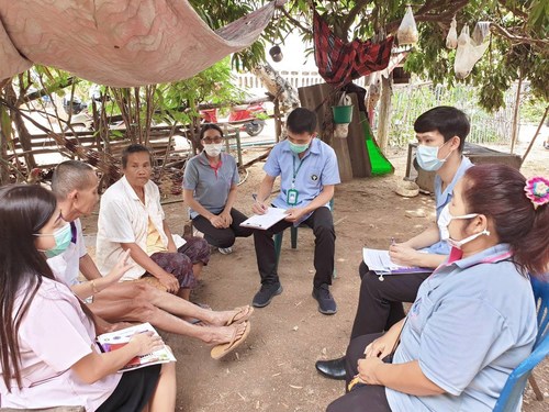 Local health volunteers providing health information to villagers on a personal basis, which is a simple but highly effective preventive measure. (Photo provided by the Ministry of Public Health, Thailand)