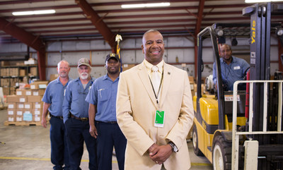 Retired U.S. Army Lt. Col. Louis Harris, standing with his team at Huntsville City Schools in Alabama, received services from Still Serving Veterans, a Call of Duty Endowment (CODE) grantee, that helped Harris find a civilian career that leverages the skill set he developed in the military.