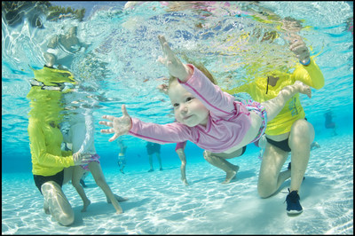 A young swimmer works on opening her eyes underwater during the World's Largest Swimming Lesson. The American Academy of Pediatrics now recommends swim lessons as a layer of protection against drowning that can begin as early as age 1. Parents can work to introduce good water safety habits and start building swim readiness skills at home.