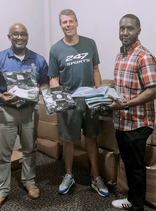 Drew Maddux (center), representing Active Performance Gear, with Boys & Girls Clubs of Middle Tennessee's Chief Executive Officer Eric Higgs (left) and Director of Operations Herbert Myers (right).