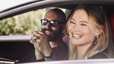 Maroon 5's Adam Levine and wife Behati Prinsloo join forces with Ferrari to benefit Save the Children. Shown here in the new Ferrari Roma.