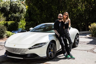 Maroon 5's Adam Levine and wife Behati Prinsloo join forces with Ferrari to benefit Save the Children. Shown here with the new Ferrari Roma.