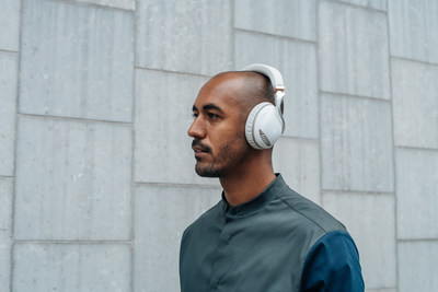 Motion Designer, Nik Hill, wears IRIS Flow Headphones in white