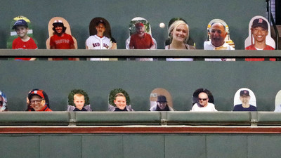 A home-run ball hit by New York Mets' Pete Alonso bounces between fan photographs placed in the seating section on top of the Green Monster left field wall seating section, during the third inning of a baseball game against the Boston Red Sox, Monday, July 27, 2020, at Fenway Park in Boston. CHARLES KRUPA AP