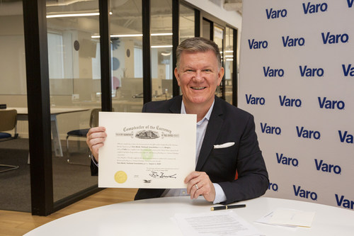 CEO and Founder Colin Walsh signs OCC charter, officially making Varo the first consumer fintech to become a national bank, July 31, 2020 - photo courtesy of Varo Money