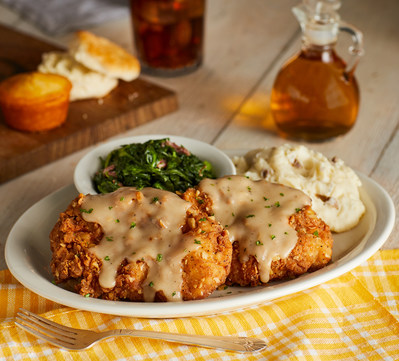 Saturday Country Fried Pork Chops feature two crispy hand-breaded fried pork chops smothered in roasted pan gravy, plus choice of two country sides and a choice of buttermilk biscuits or corn muffins.