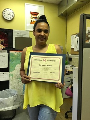 Caregiver proudly displays Certificate of Completion of COVID-19 Care Training